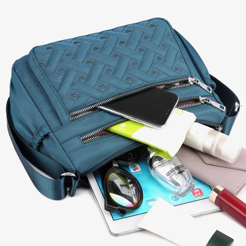 Noora™ | Nylon schoudertas met boodschapper