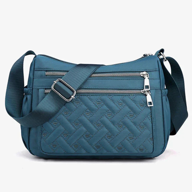 Noora™ | Nylon schoudertas met boodschapper