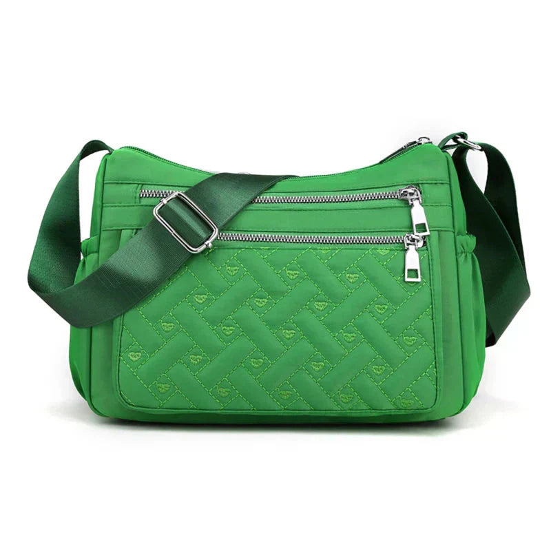 Noora™ | Nylon schoudertas met boodschapper