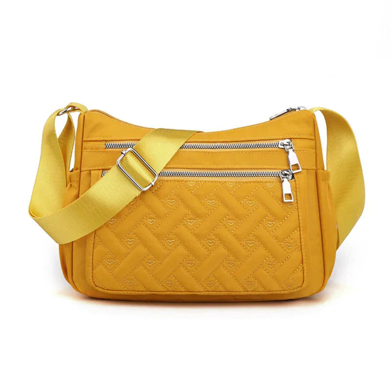 Noora™ | Nylon schoudertas met boodschapper