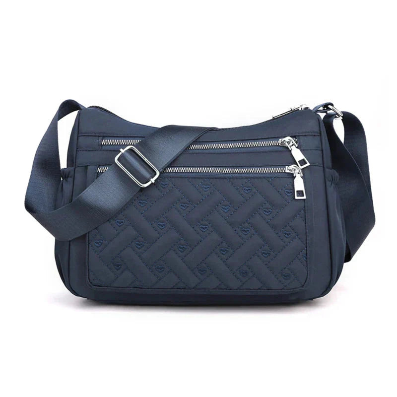Noora™ | Nylon schoudertas met boodschapper